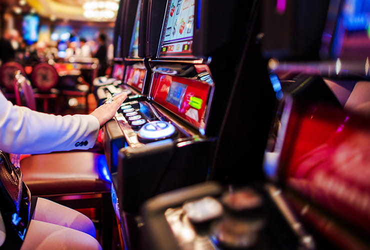 A person playing at the slot machines