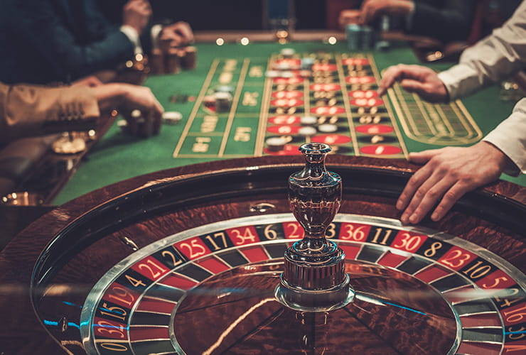 People playing at the roulette table