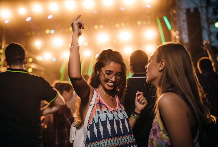 Two girls dancing and having a great time in the club